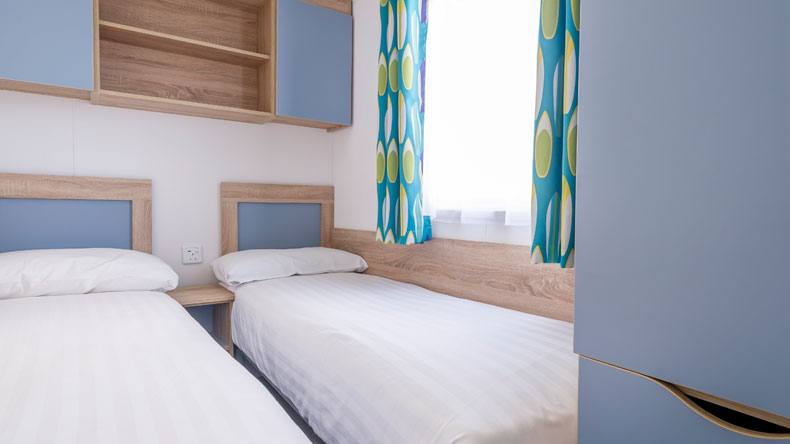 New Wave Gold caravan twin bedroom